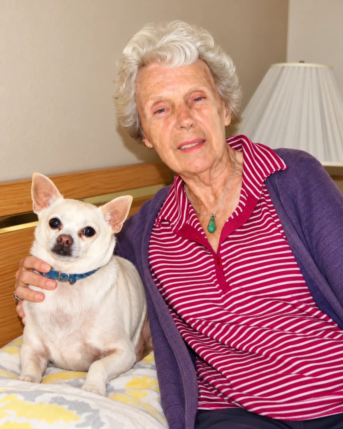 Smiling resident with her dog